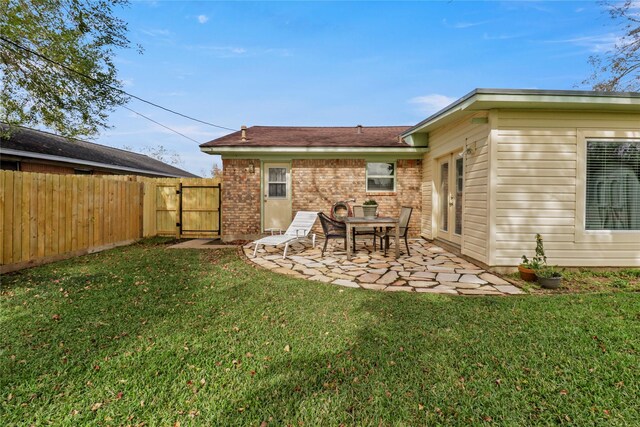 view of yard featuring a gate, a patio area, and fence