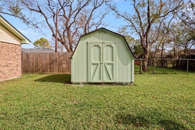 view of shed with a fenced backyard