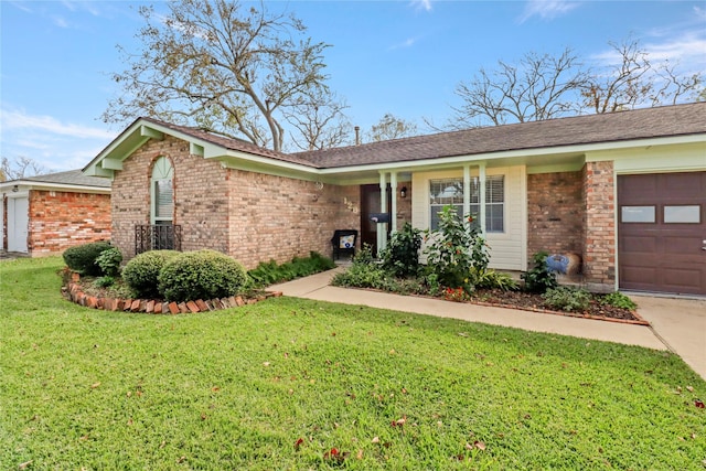 ranch-style home with a garage and a front yard