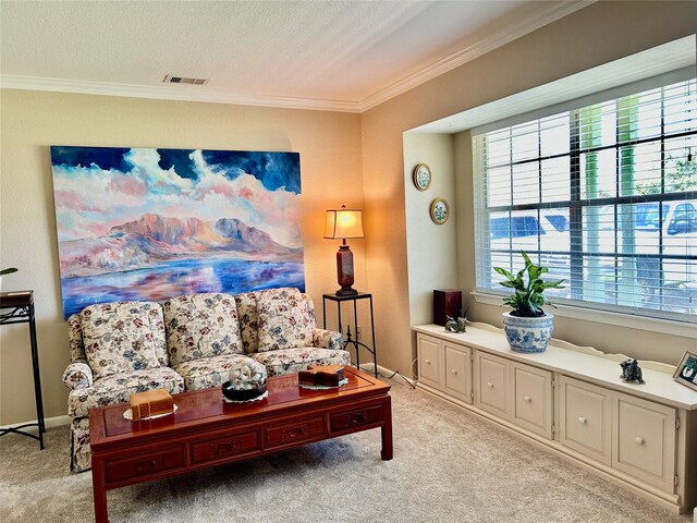 living room featuring visible vents, baseboards, light colored carpet, and crown molding