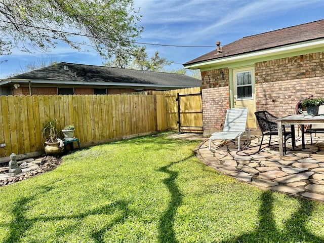 view of yard featuring a patio area and fence