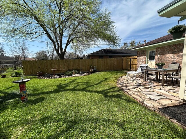 view of yard with a patio area and fence