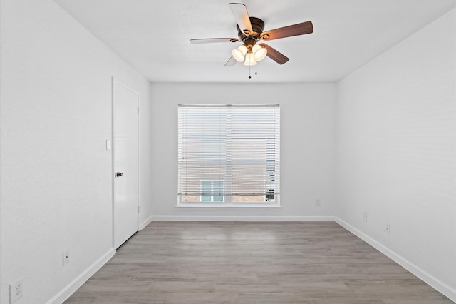 spare room with ceiling fan and light hardwood / wood-style floors