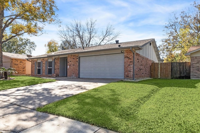 ranch-style home featuring a front yard and a garage