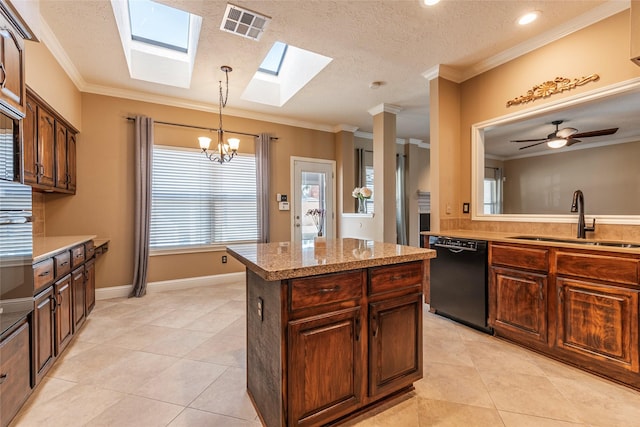 kitchen with black dishwasher, sink, a center island, light tile patterned floors, and crown molding