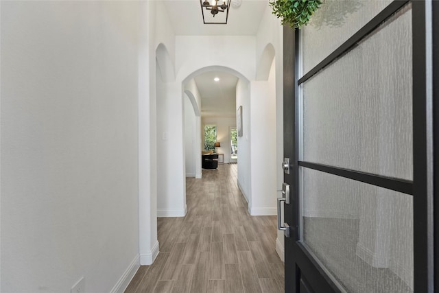 hall with light hardwood / wood-style floors