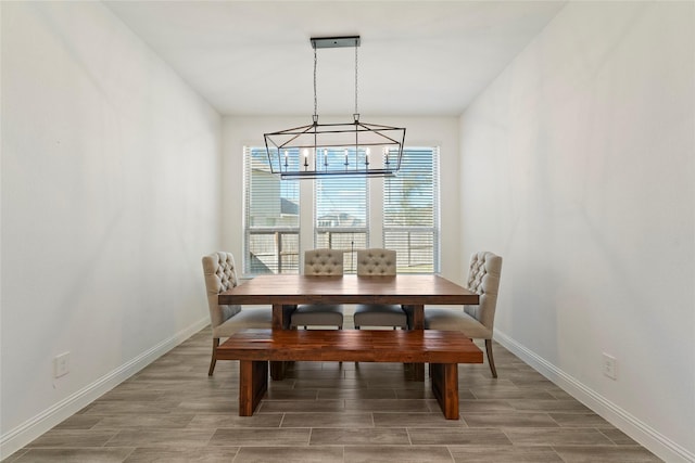 dining space with a chandelier