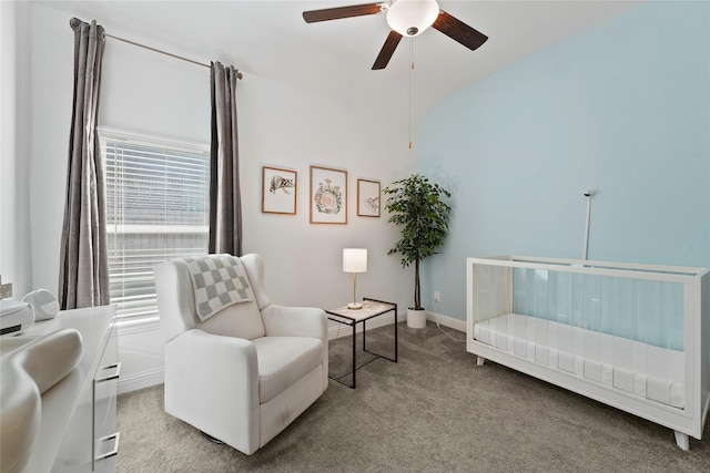 living area featuring carpet floors, plenty of natural light, and ceiling fan