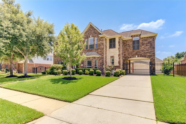 view of front of home with a front yard and a garage