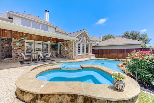 view of swimming pool featuring a patio and ceiling fan