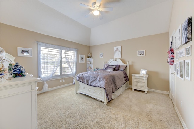 bedroom with light carpet, vaulted ceiling, and ceiling fan