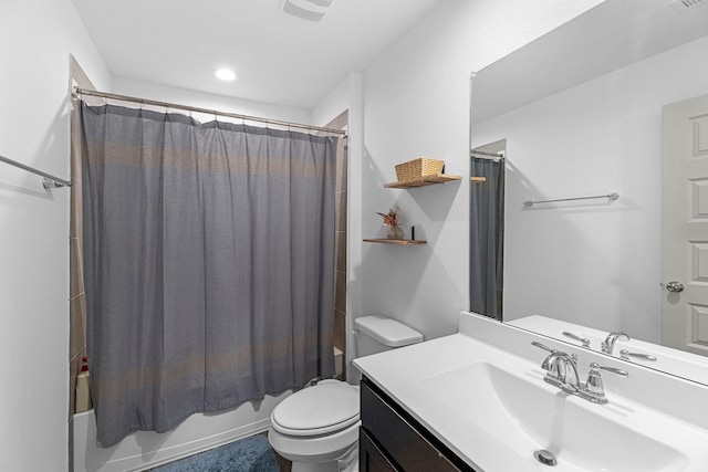 full bathroom featuring shower / bath combo with shower curtain, vanity, and toilet