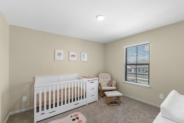 bedroom with carpet flooring and a nursery area