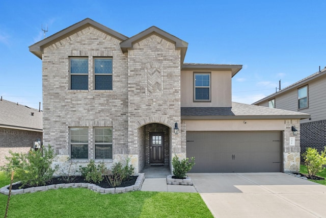 view of front facade with a front lawn and a garage