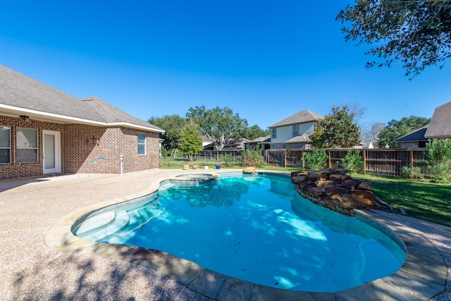 view of swimming pool featuring an in ground hot tub and a patio area