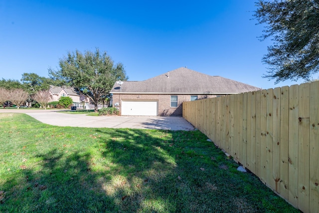 view of yard featuring a garage