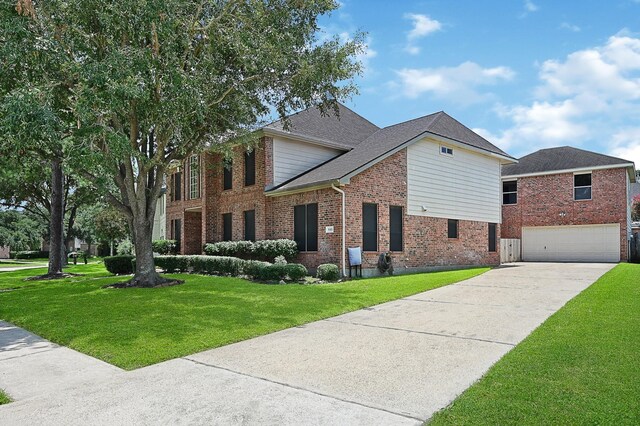 view of front facade with a front yard and a garage