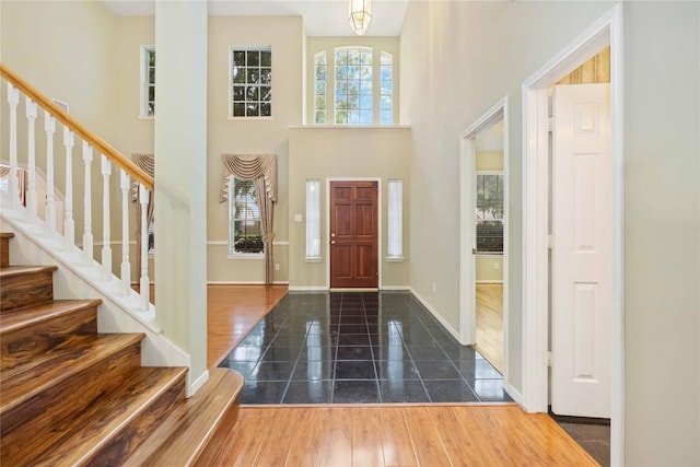 entryway featuring a towering ceiling