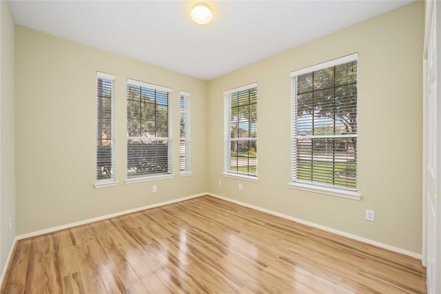 spare room featuring light wood-type flooring