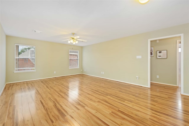 unfurnished room featuring ceiling fan and light hardwood / wood-style floors