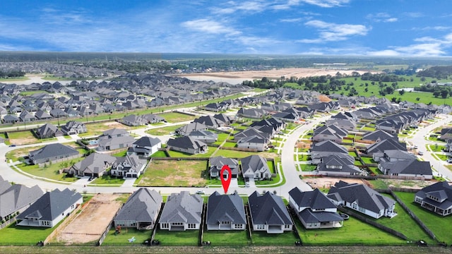 birds eye view of property with a residential view