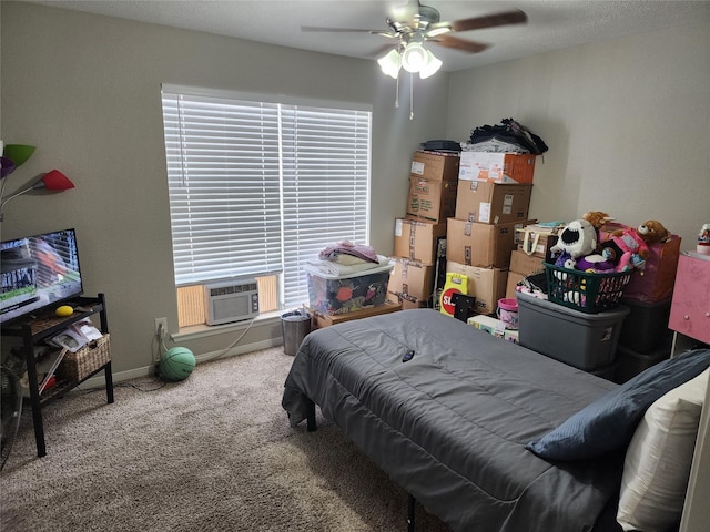 bedroom featuring carpet, ceiling fan, and cooling unit