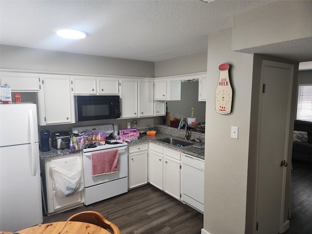 kitchen featuring sink, white cabinets, and white appliances