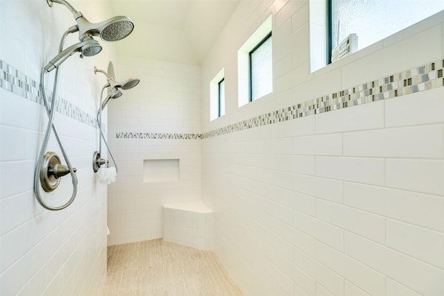 bathroom with a tile shower