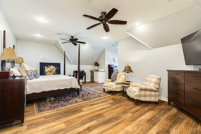 bedroom featuring lofted ceiling, hardwood / wood-style floors, and ceiling fan