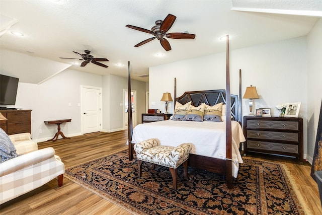 bedroom featuring hardwood / wood-style flooring and ceiling fan