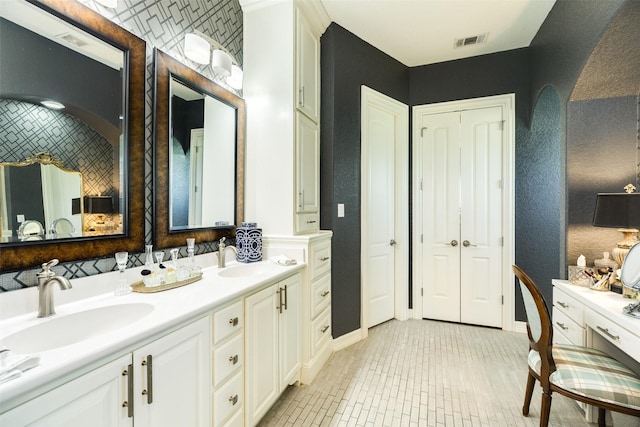 bathroom with tile patterned flooring and vanity