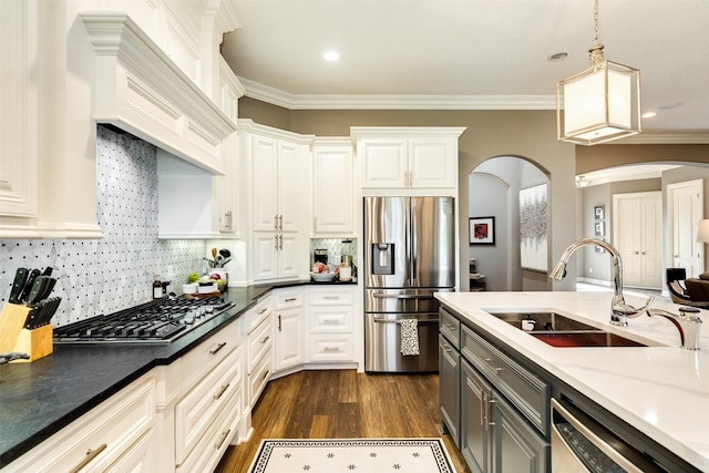 kitchen with gray cabinets, white cabinetry, appliances with stainless steel finishes, and pendant lighting