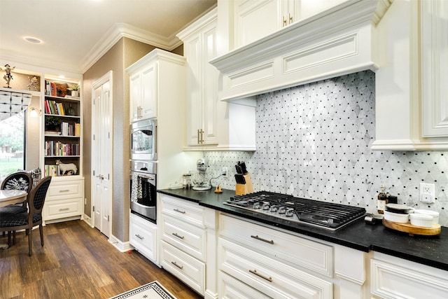 kitchen featuring stainless steel appliances, premium range hood, dark hardwood / wood-style floors, and white cabinetry