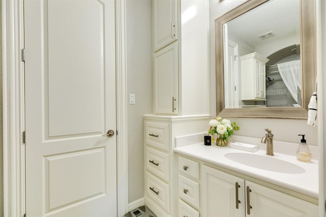 bathroom with vanity and a textured ceiling