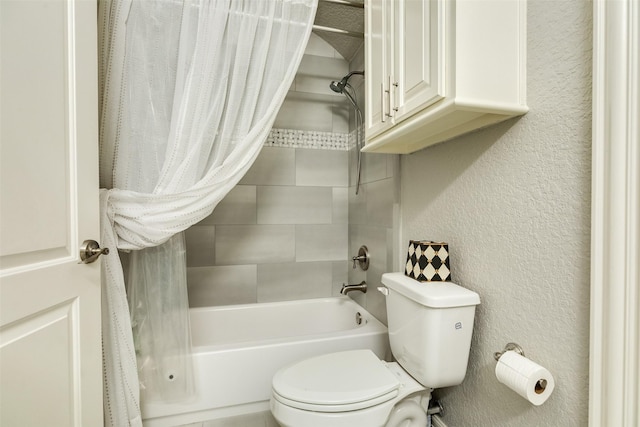 bathroom featuring shower / tub combo and toilet