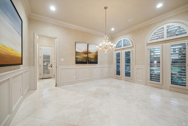 unfurnished dining area featuring crown molding and a notable chandelier