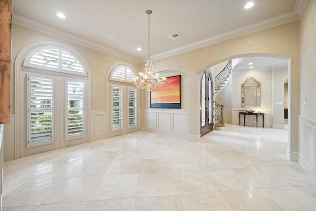 unfurnished dining area featuring an inviting chandelier and ornamental molding