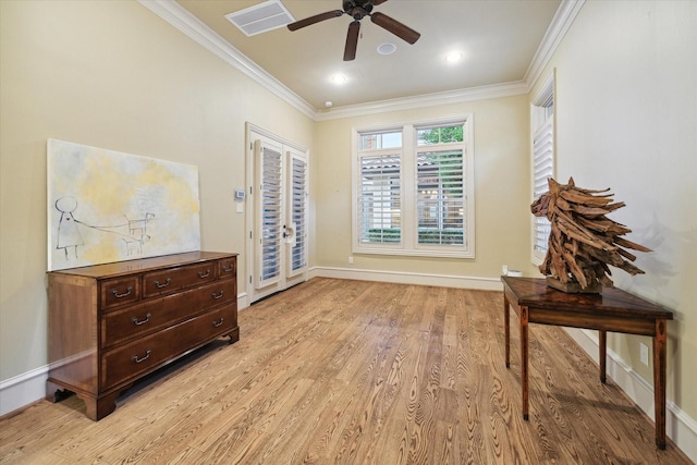 interior space featuring ceiling fan, light hardwood / wood-style floors, access to exterior, and crown molding