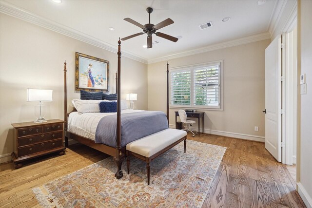 bedroom with ornamental molding, ceiling fan, and light hardwood / wood-style floors