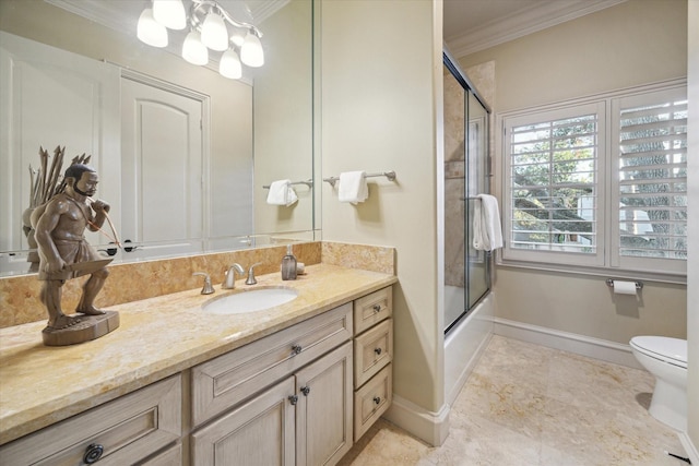 full bathroom with crown molding, vanity, bath / shower combo with glass door, and toilet