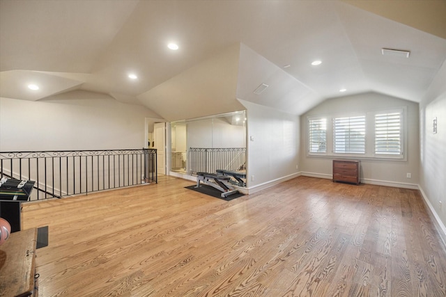 bonus room featuring hardwood / wood-style flooring and vaulted ceiling