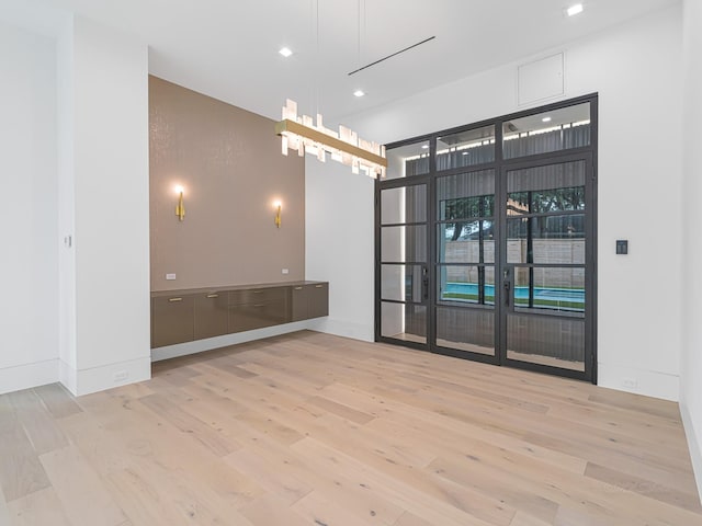 spare room featuring light wood-type flooring