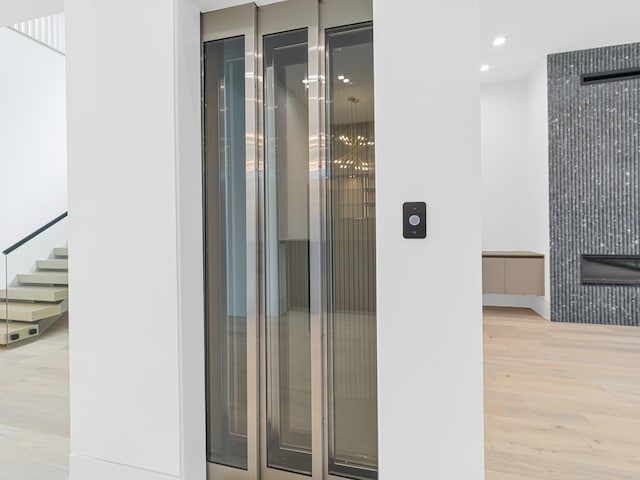 interior space featuring hardwood / wood-style flooring and elevator