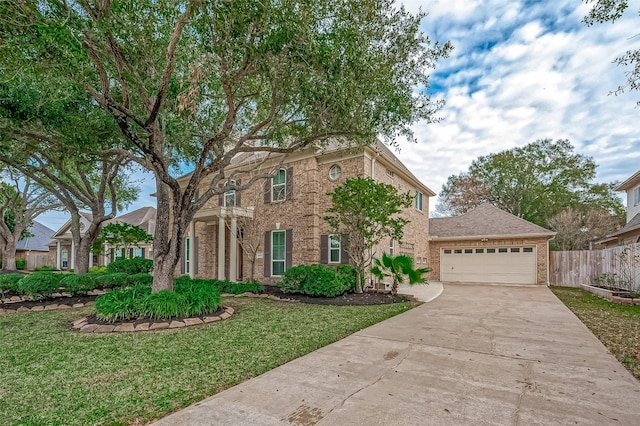 view of front of home with a front lawn and a garage