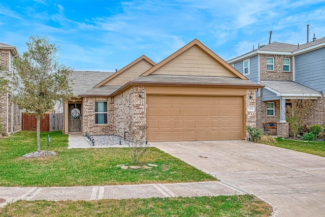 view of front of home featuring a front yard and a garage