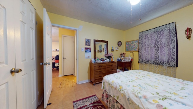 bedroom featuring a textured ceiling