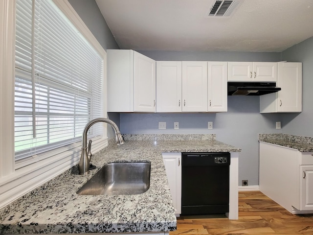 kitchen featuring sink, white cabinetry, black dishwasher, light stone countertops, and light hardwood / wood-style floors