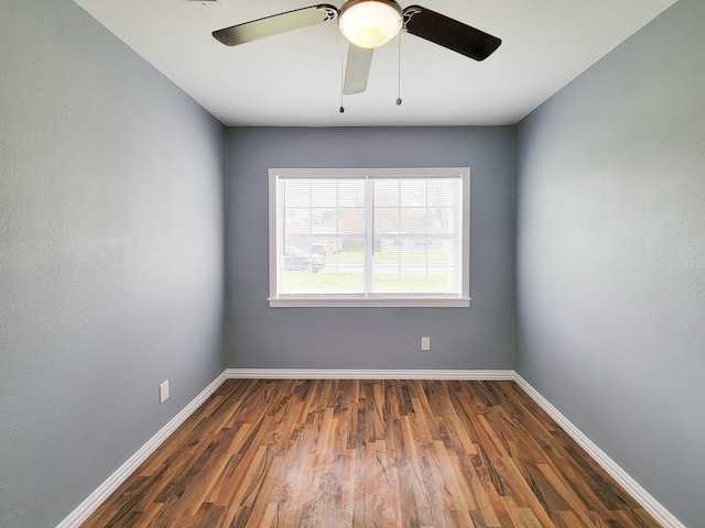 unfurnished room with dark wood-type flooring