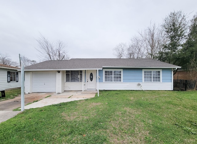 ranch-style home with a garage and a front lawn