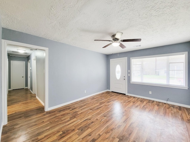 entryway featuring hardwood / wood-style floors, a textured ceiling, and ceiling fan